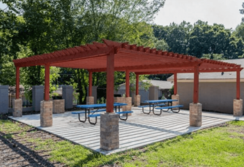 a picnic area with benches and a pavilion